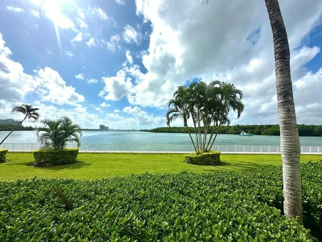 a view of a fountain in the middle of a garden