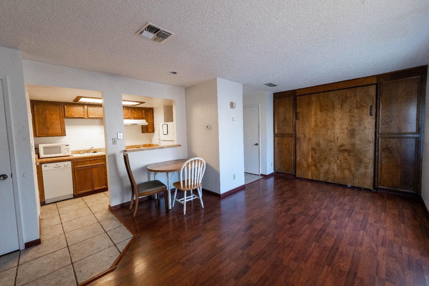 3701 Colonial Drive, Unit 34 Modesto, CA 95356 - Photo 3 of 10 a view of a dining room with furniture and wooden floor