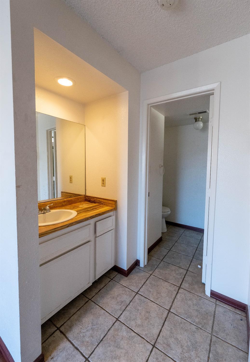 3701 Colonial Drive, Unit 34 Modesto, CA 95356 - Photo 4 of 10 a view of an empty room with window and a kitchen