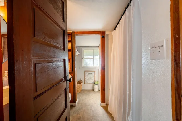 a view of a bathroom from a hallway
