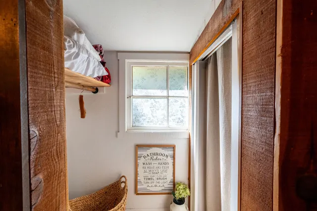 a view of balcony with wooden floor and outdoor seating