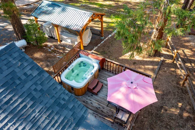 a view of a deck with furniture and a yard
