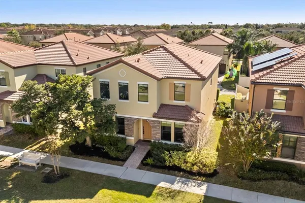a aerial view of a house with a yard