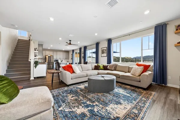 a living room with furniture and a large window