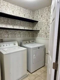 a utility room with dryer and washer