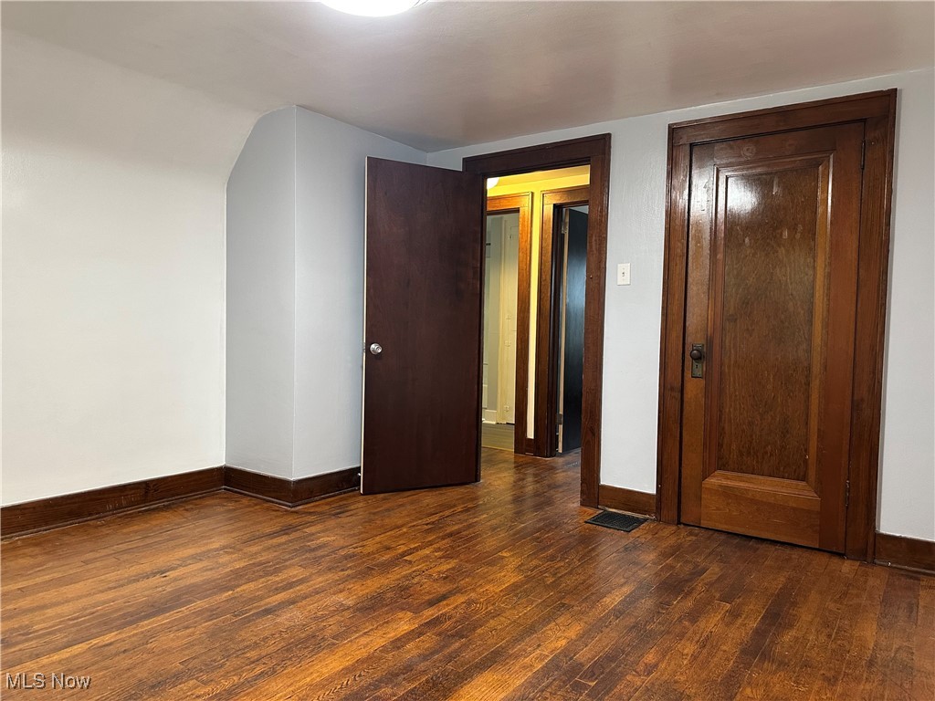 7954 Warren - Sharon Road Masury, OH 44438 - Photo 18 of 28 Unfurnished bedroom featuring dark wood finished floors and baseboards