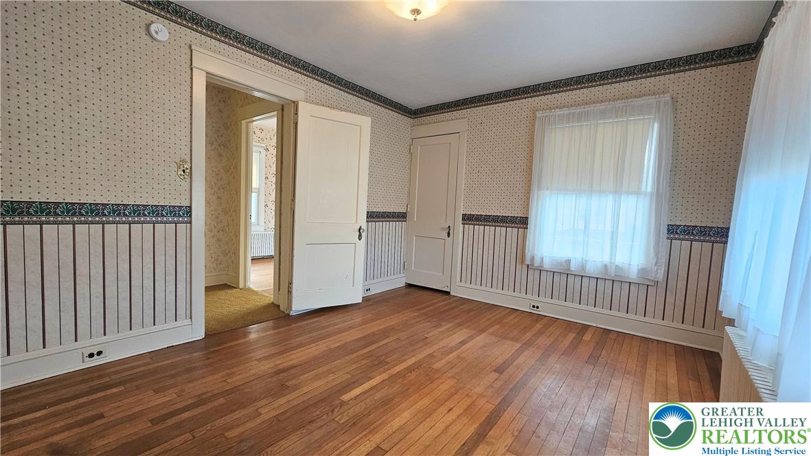 1936 Kemmerer Street Bethlehem, PA 18017 - Photo 19 of 27 a view of an empty room with wooden floor