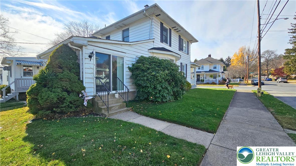 1936 Kemmerer Street Bethlehem, PA 18017 - Photo 23 of 27 a view of a white house next to a yard with big trees