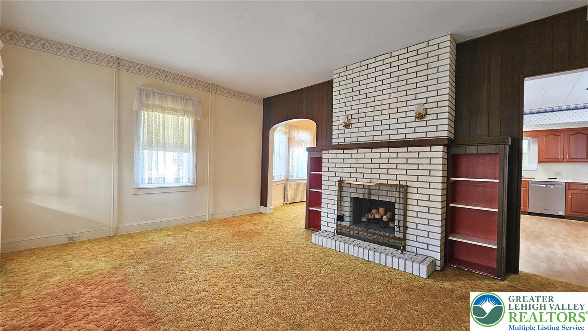 1936 Kemmerer Street Bethlehem, PA 18017 - Photo 5 of 27 a living room with furniture and a fireplace
