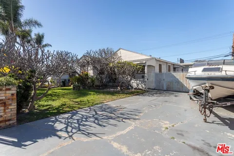 a view of a backyard with sitting area