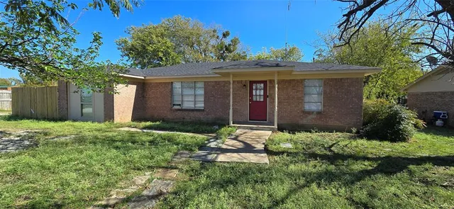 front view of a house with a yard