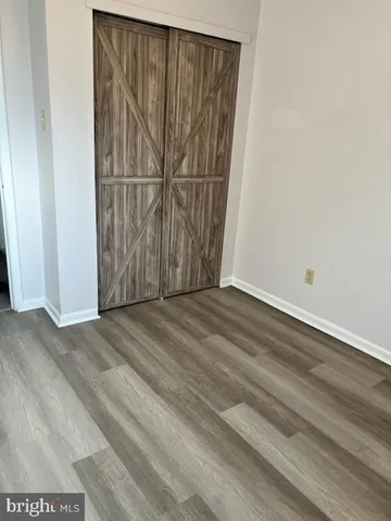 an empty room with wooden floor