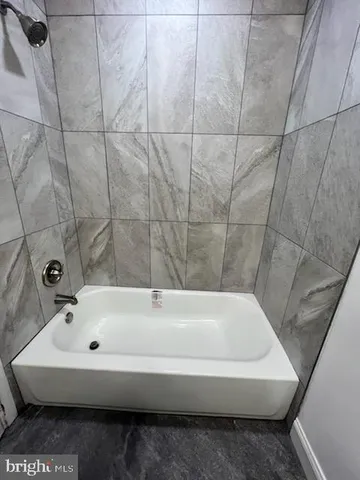 a bathroom with a bathtub