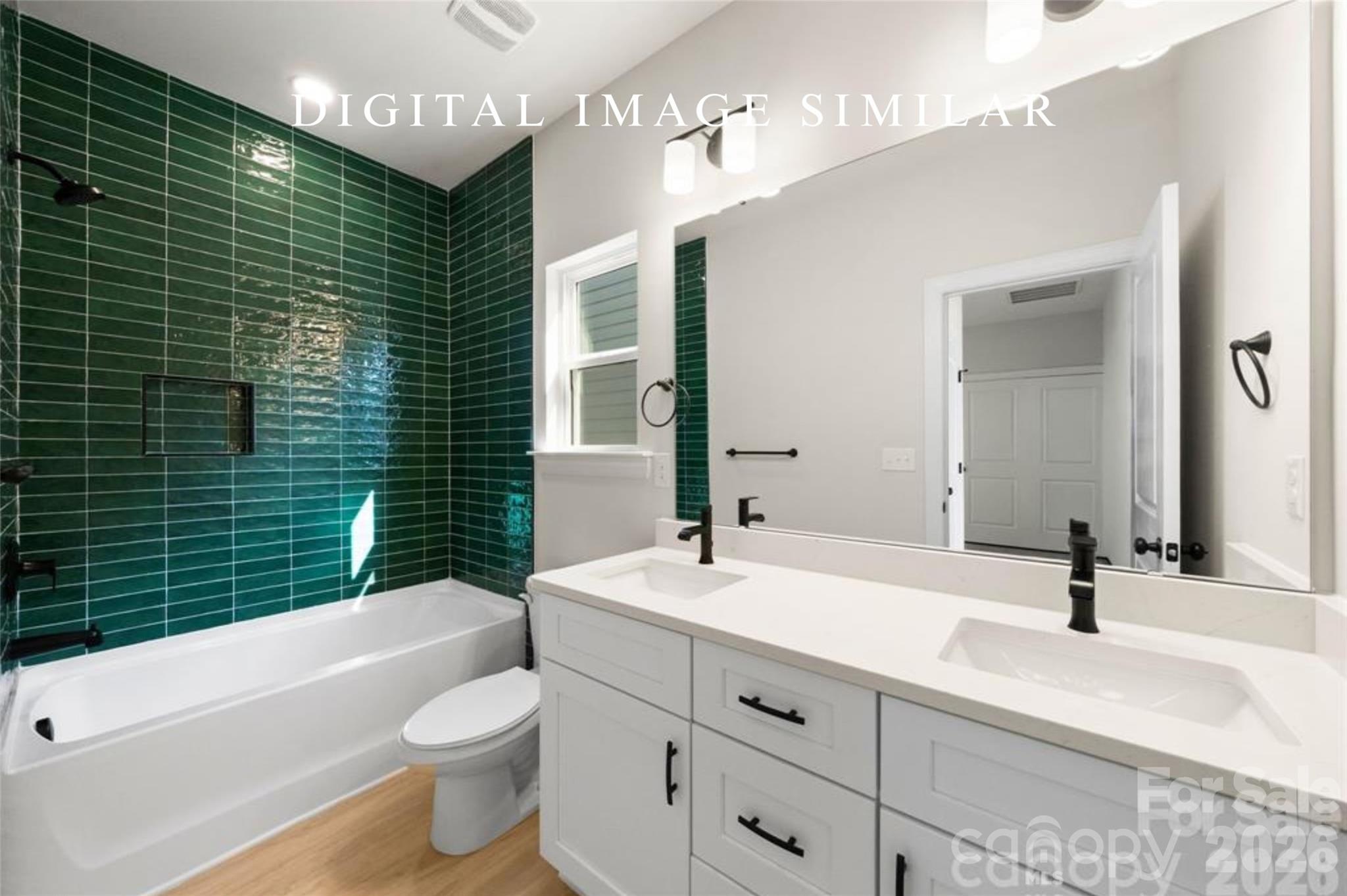 2928 Mulberry Church Road Charlotte, NC 28208 - Photo 30 of 43 a bathroom with a double vanity sink toilet and shower