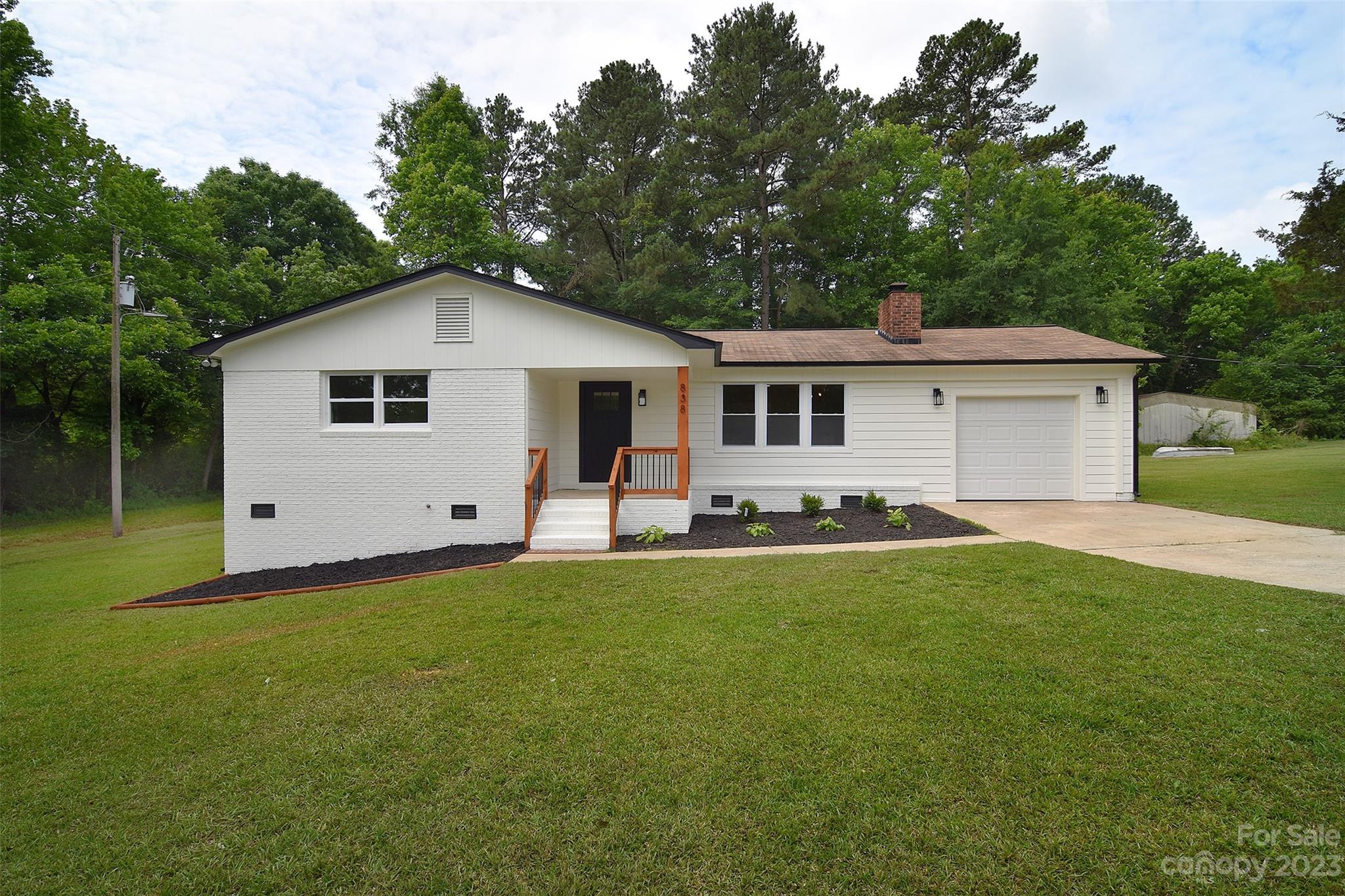 838 Culdesac Road Lancaster, SC 29720 - Photo 1 of 30 a front view of a house with a garden