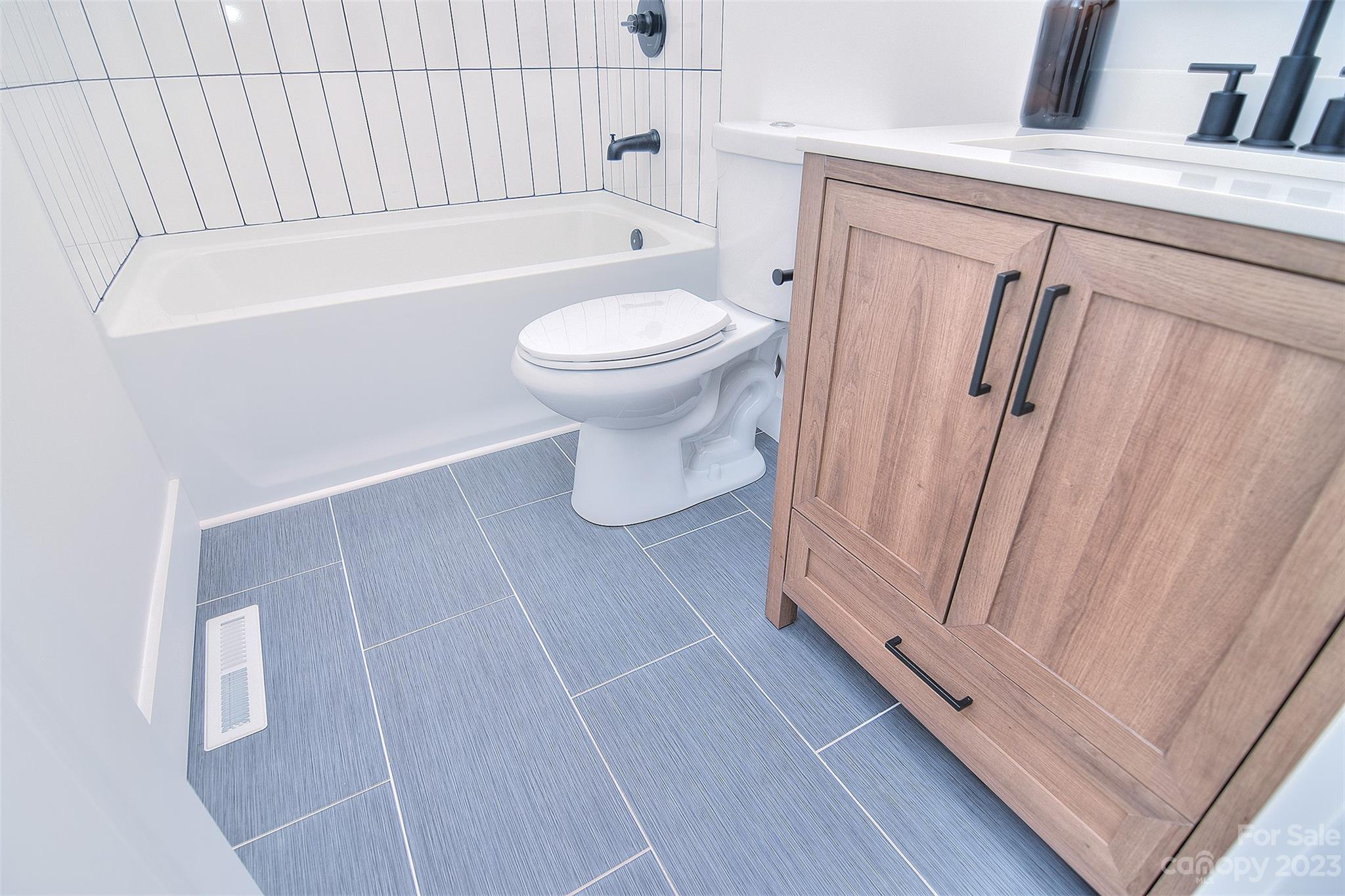 838 Culdesac Road Lancaster, SC 29720 - Photo 12 of 30 a bathroom with a toilet and a bathtub