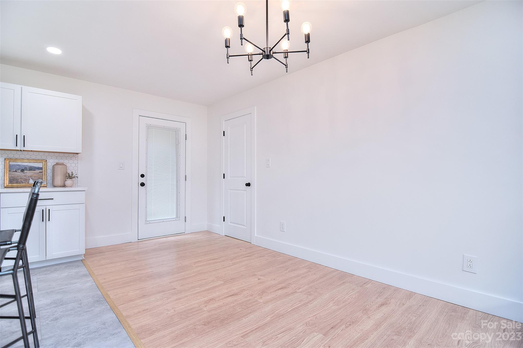 838 Culdesac Road Lancaster, SC 29720 - Photo 15 of 30 a view of a room with wooden floor and a ceiling fan