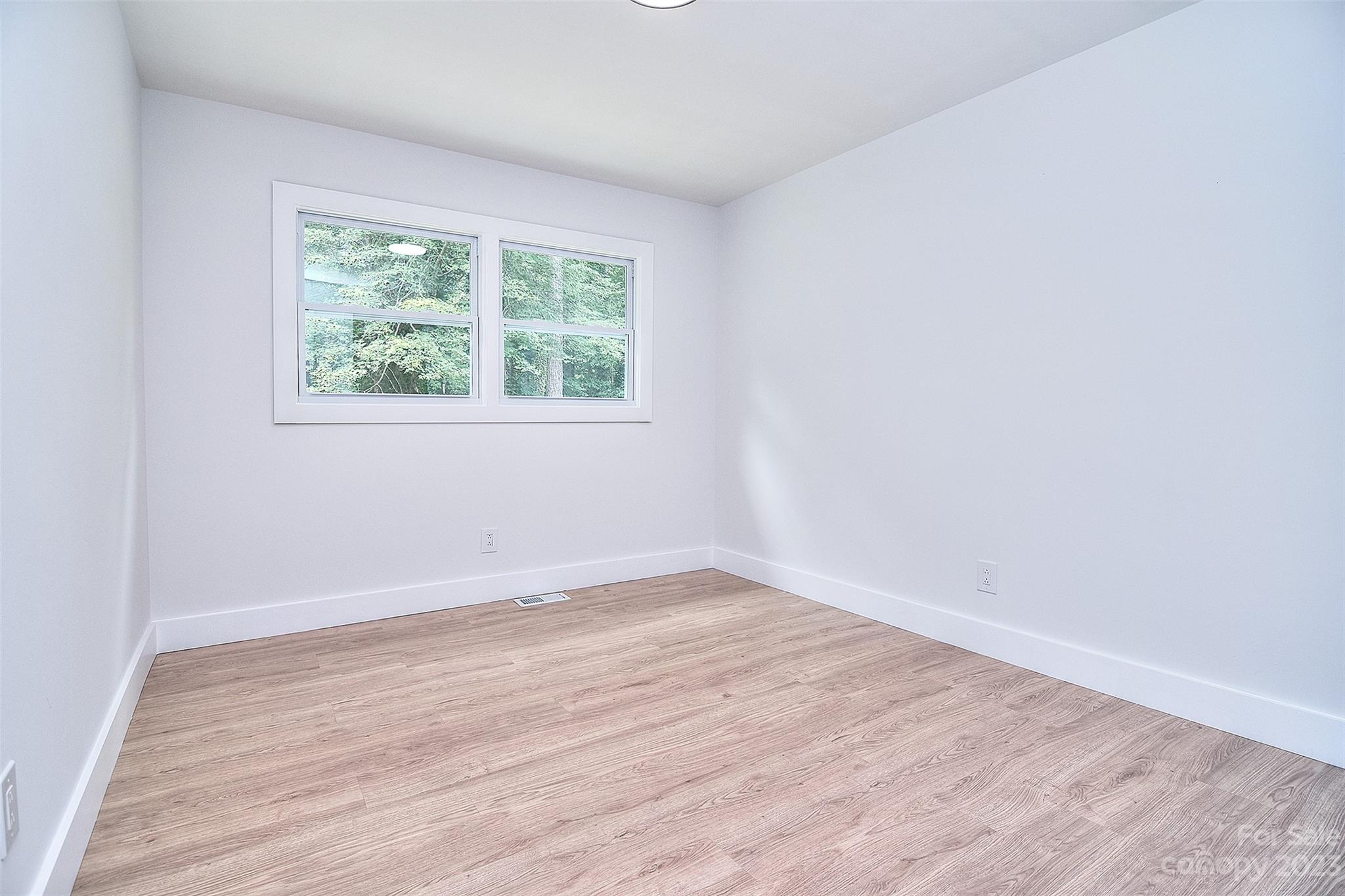 838 Culdesac Road Lancaster, SC 29720 - Photo 21 of 30 wooden floor in an empty room with a window
