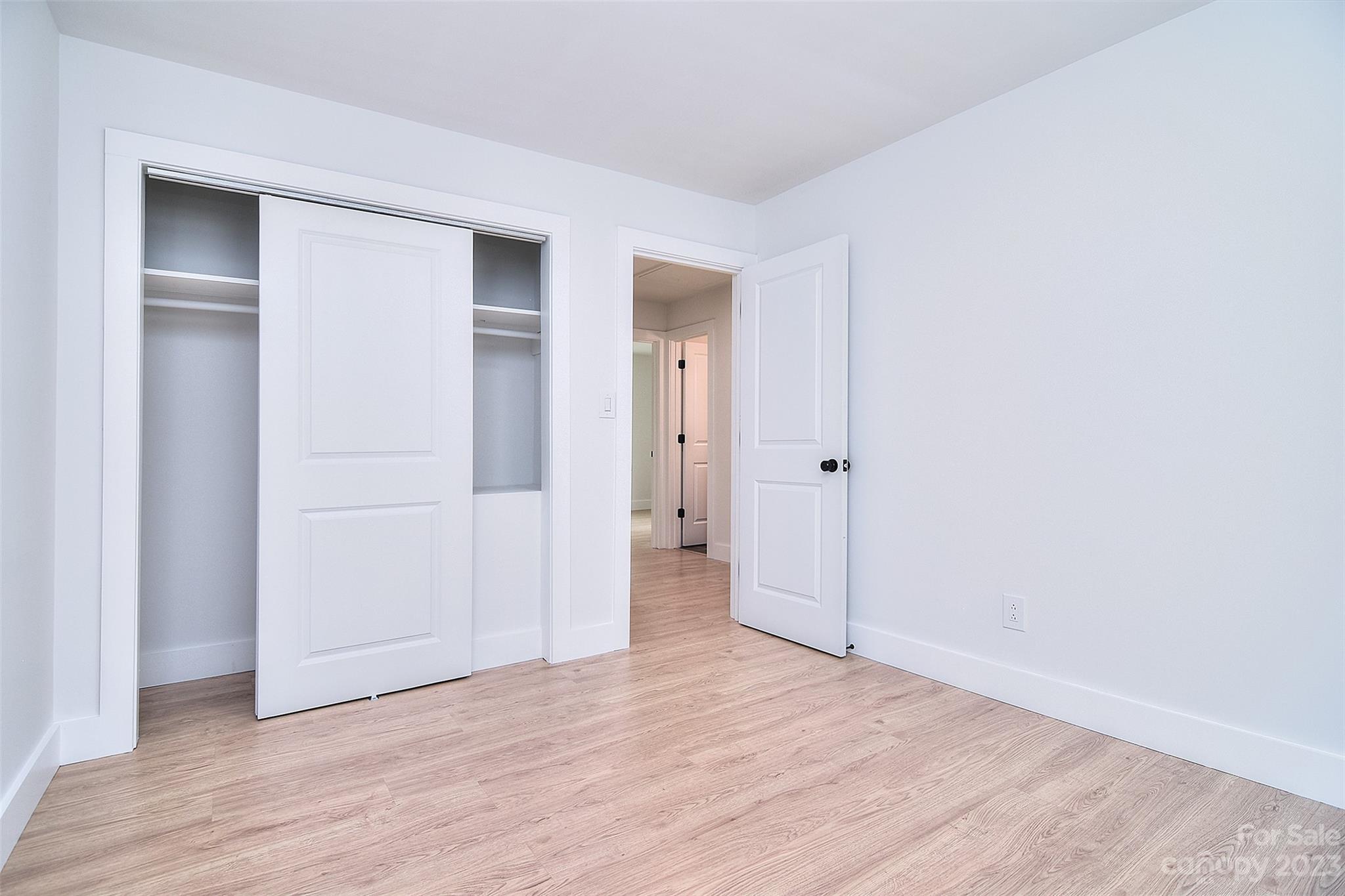 838 Culdesac Road Lancaster, SC 29720 - Photo 22 of 30 a view of an empty room with wooden floor