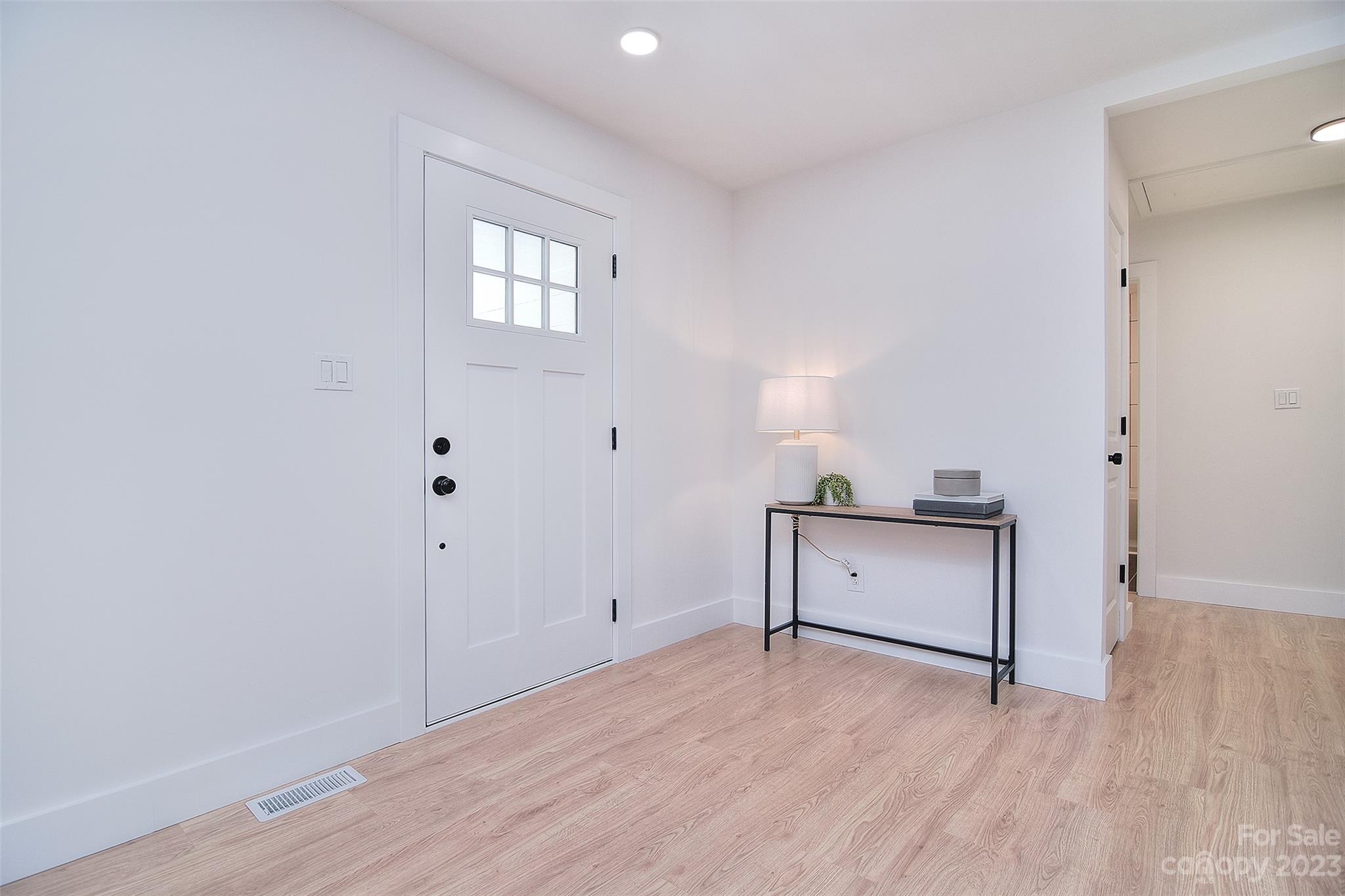 838 Culdesac Road Lancaster, SC 29720 - Photo 23 of 30 a view of an empty room with window and wooden floor