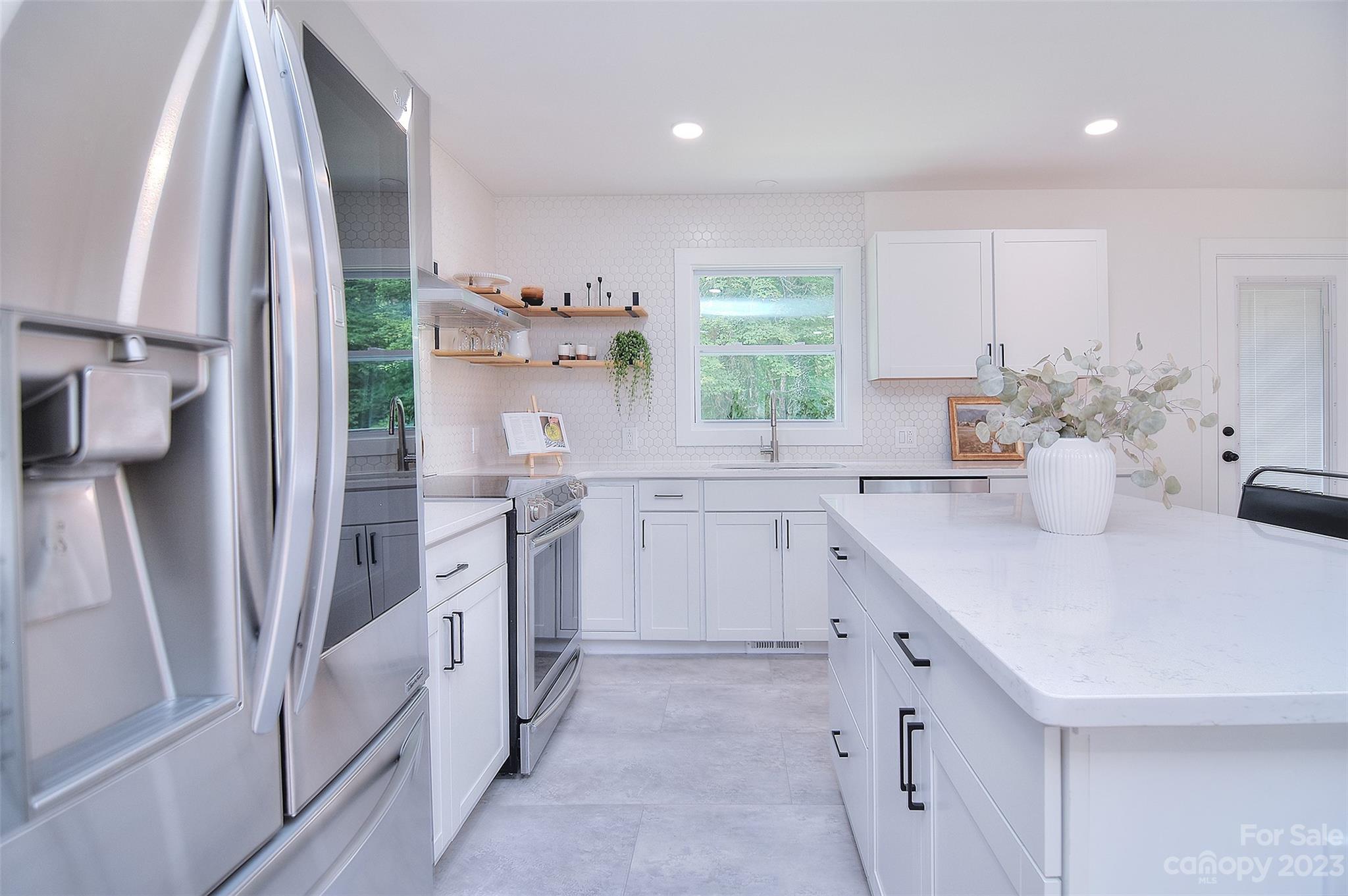 838 Culdesac Road Lancaster, SC 29720 - Photo 5 of 30 a kitchen with a sink stove and cabinets