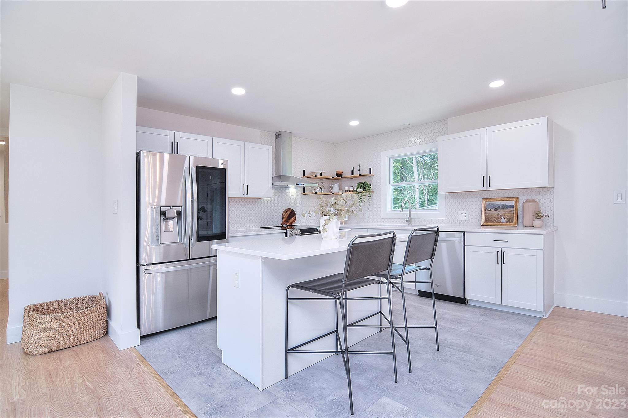 838 Culdesac Road Lancaster, SC 29720 - Photo 6 of 30 a kitchen with white cabinets and stainless steel appliances