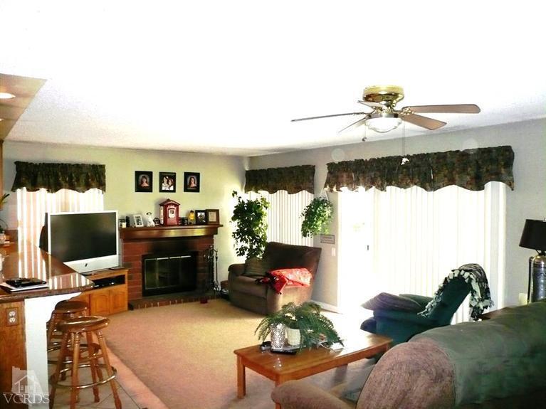12456 Crystal Ranch Road Moorpark, CA 93021 - Photo 14 of 31 a living room with furniture and a flat screen tv