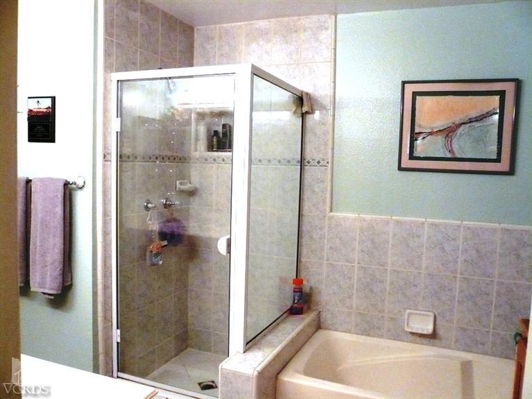 12456 Crystal Ranch Road Moorpark, CA 93021 - Photo 22 of 31 a bathroom with a bathtub and a shower