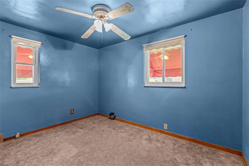 21 Ryan Drive Pittsburgh, PA 15220 - Photo 21 of 28 an empty room with a window and a fan