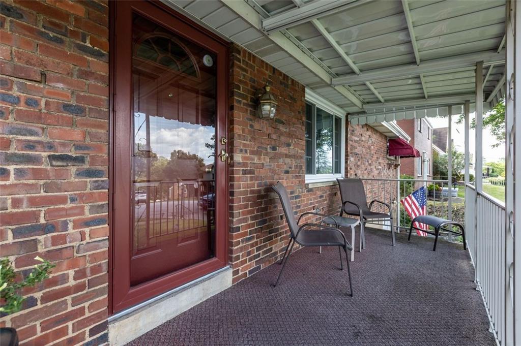 21 Ryan Drive Pittsburgh, PA 15220 - Photo 3 of 28 a view of a porch with furniture and a backyard
