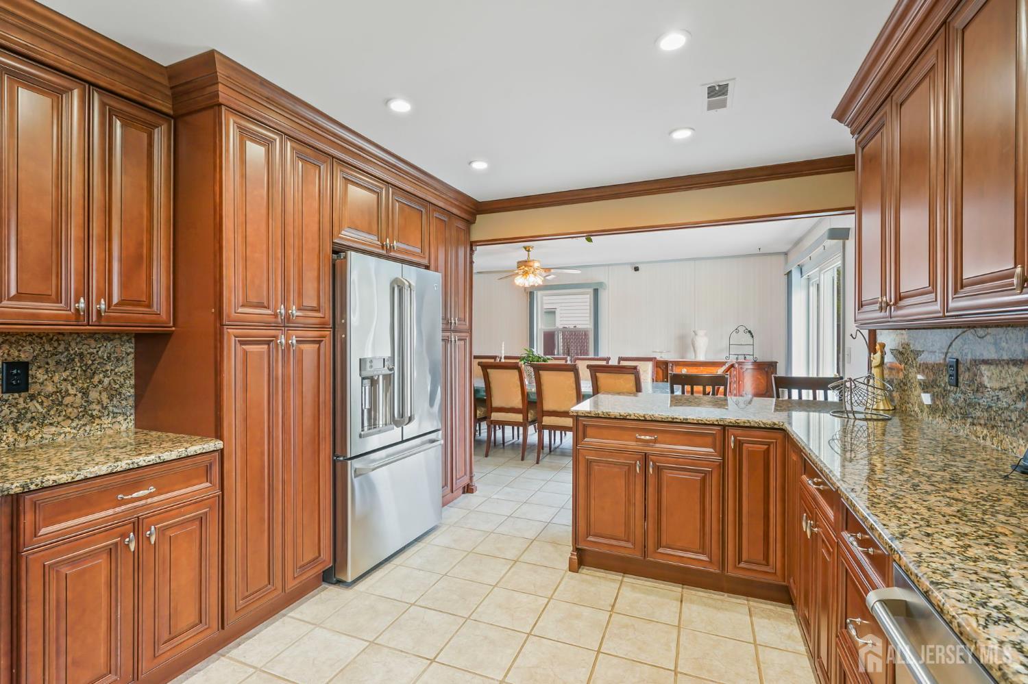41 Rodak Circle Edison, NJ 08817 - Photo 11 of 28 a kitchen with stainless steel appliances granite countertop a refrigerator and a sink