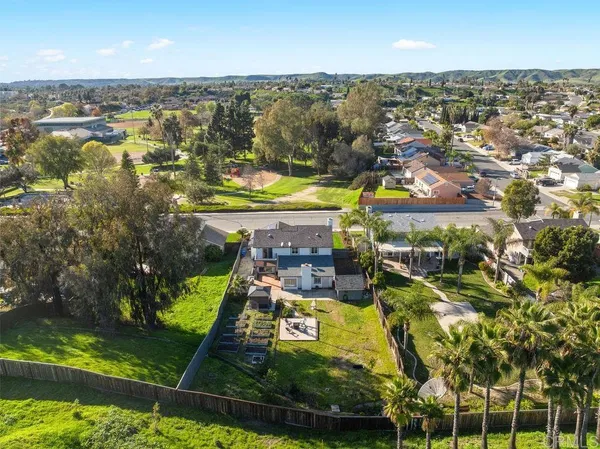 an aerial view of a house with a ocean view