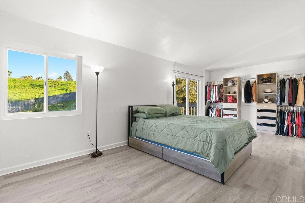 5322 Leon Street Oceanside, CA 92057 - Photo 30 of 73 a bedroom with a bed and a flat screen tv