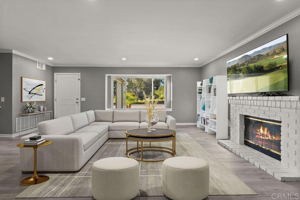 5322 Leon Street Oceanside, CA 92057 - Photo 8 of 73 a living room with furniture a fireplace and a flat screen tv