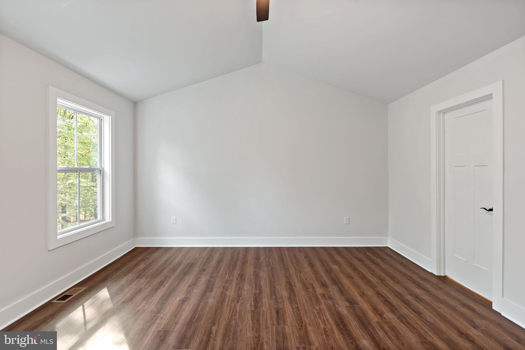 2 Libby's Ridge Road Berkeley Springs, WV 25411 - Photo 20 of 35 wooden floor in an empty room with a window