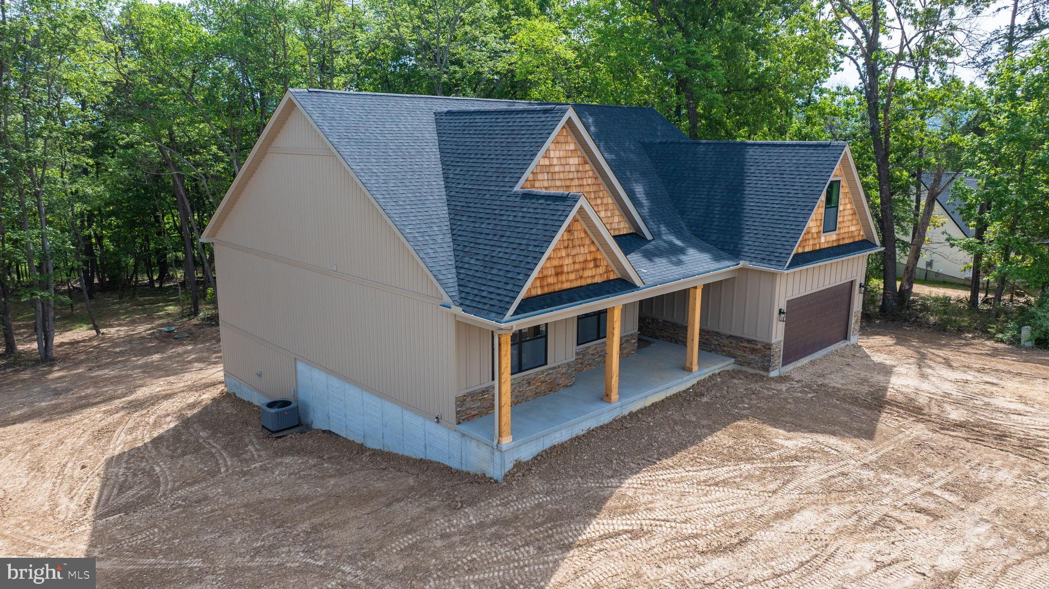 2 Libby's Ridge Road Berkeley Springs, WV 25411 - Photo 2 of 35 a view of small house with wooden fence