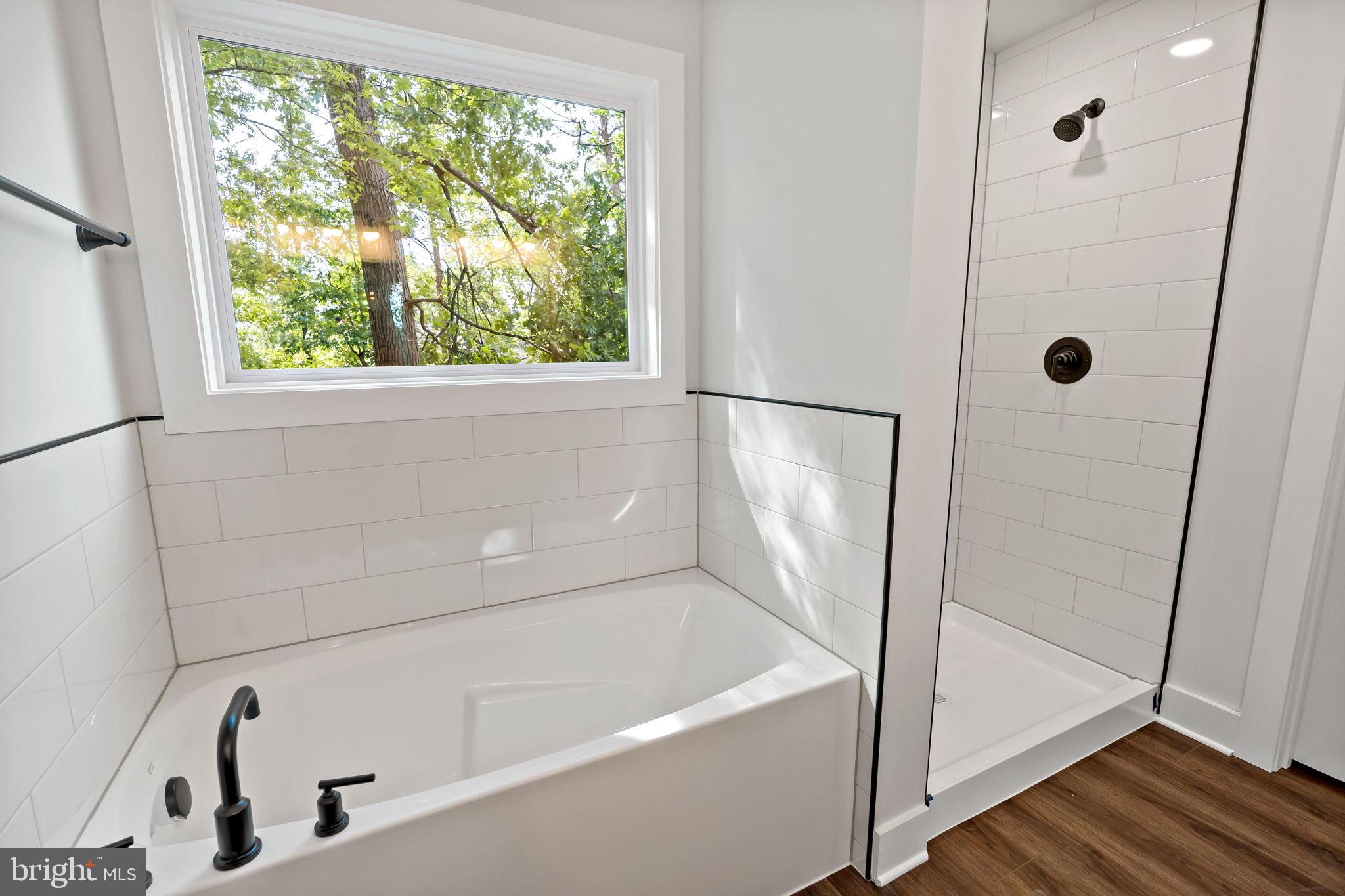 2 Libby's Ridge Road Berkeley Springs, WV 25411 - Photo 23 of 35 a bathroom with a tub and a shower