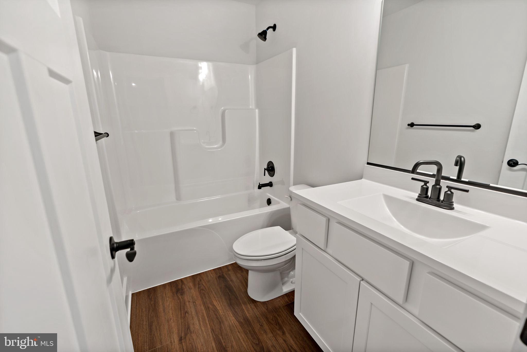 2 Libby's Ridge Road Berkeley Springs, WV 25411 - Photo 27 of 35 a bathroom with a sink toilet and shower