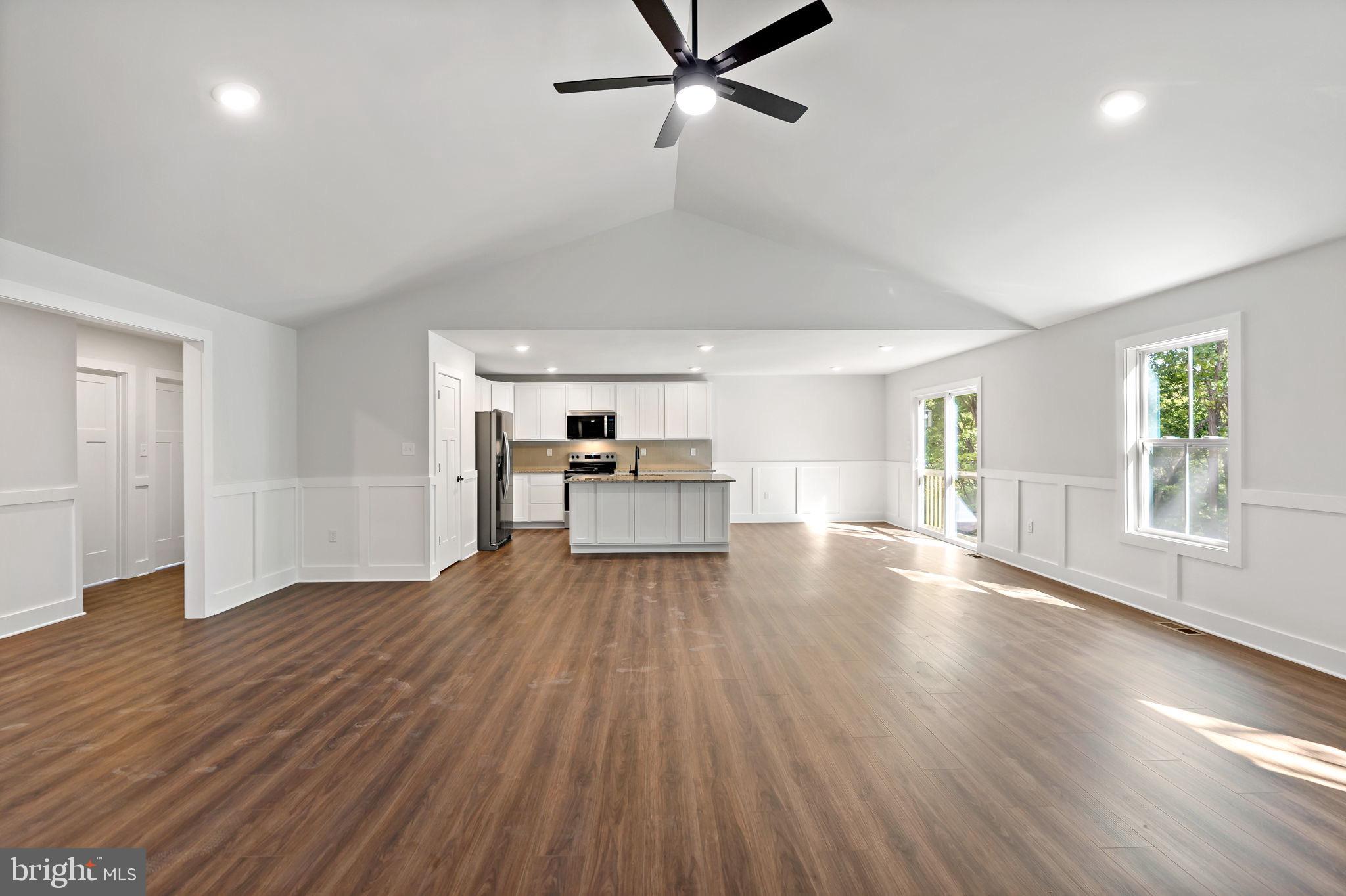 2 Libby's Ridge Road Berkeley Springs, WV 25411 - Photo 6 of 35 a view of empty room with wooden floor and window