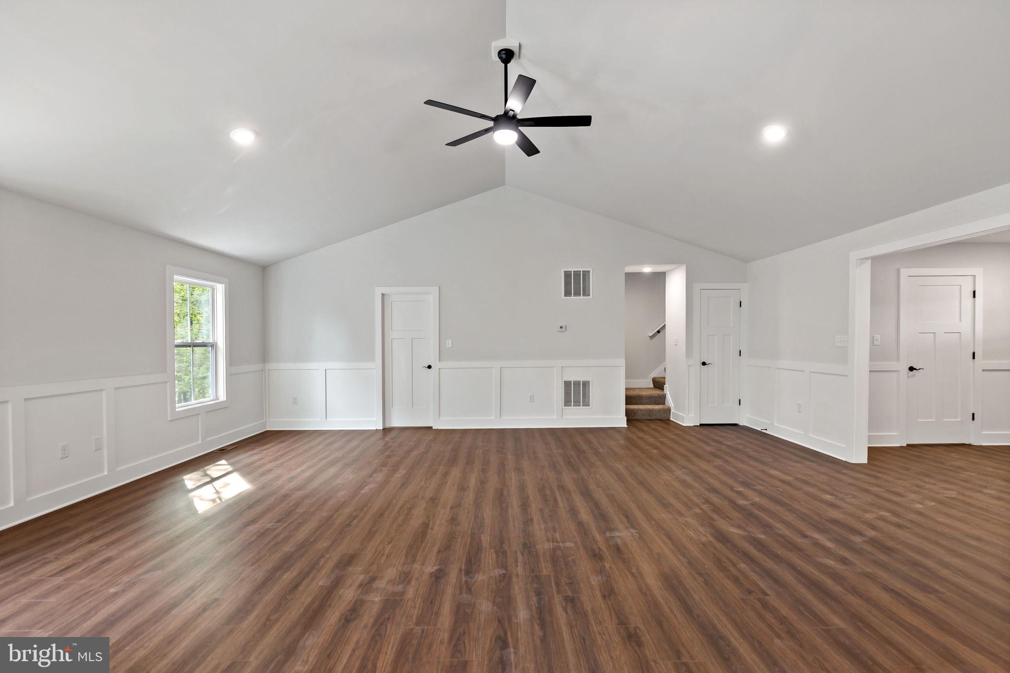 2 Libby's Ridge Road Berkeley Springs, WV 25411 - Photo 8 of 35 a view of empty room with wooden floor and fan