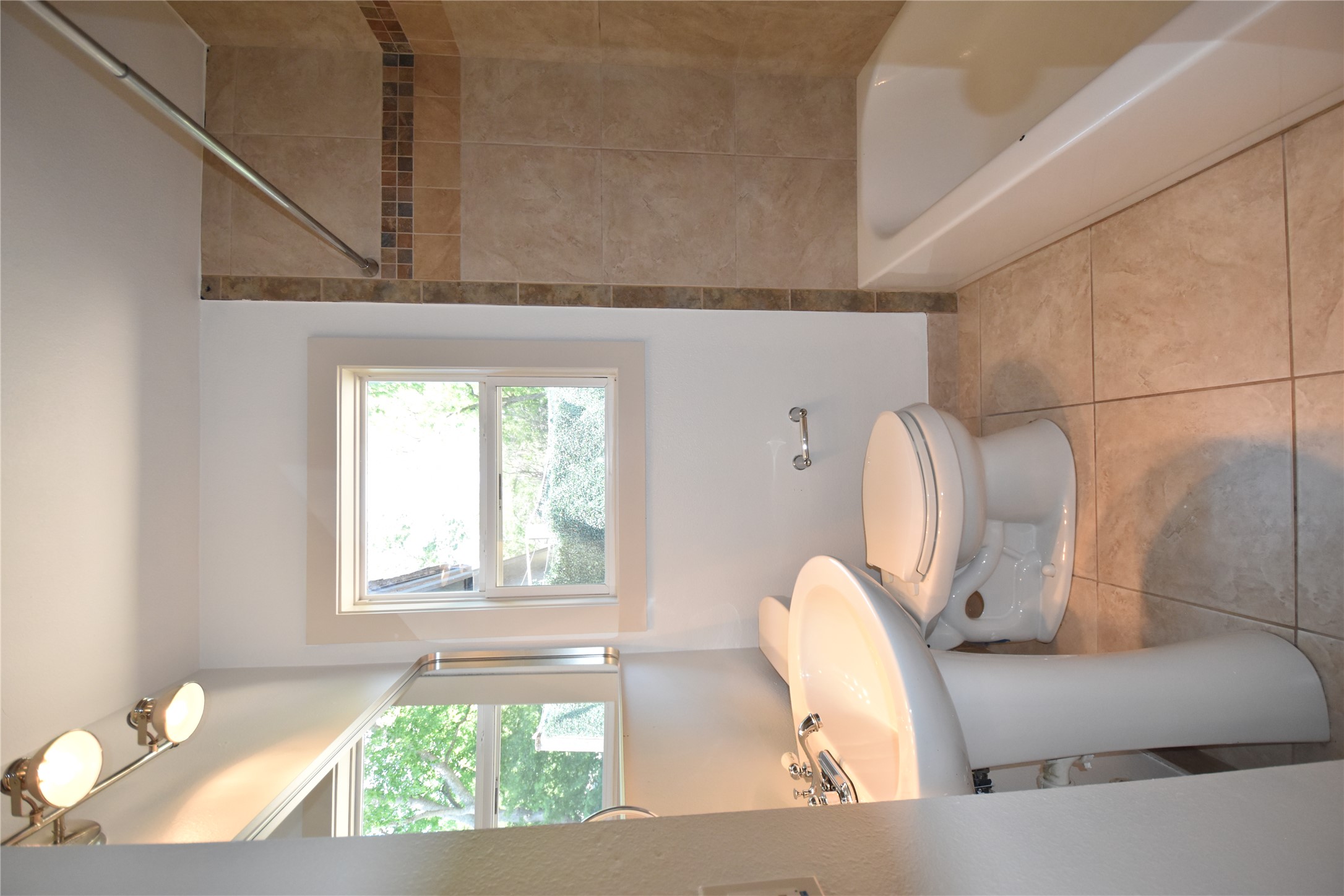 2012 Payne Avenue, Unit A Austin, TX 78757 - Photo 17 of 33 Bathroom featuring a pedestal sink, a toilet, and tile flooring