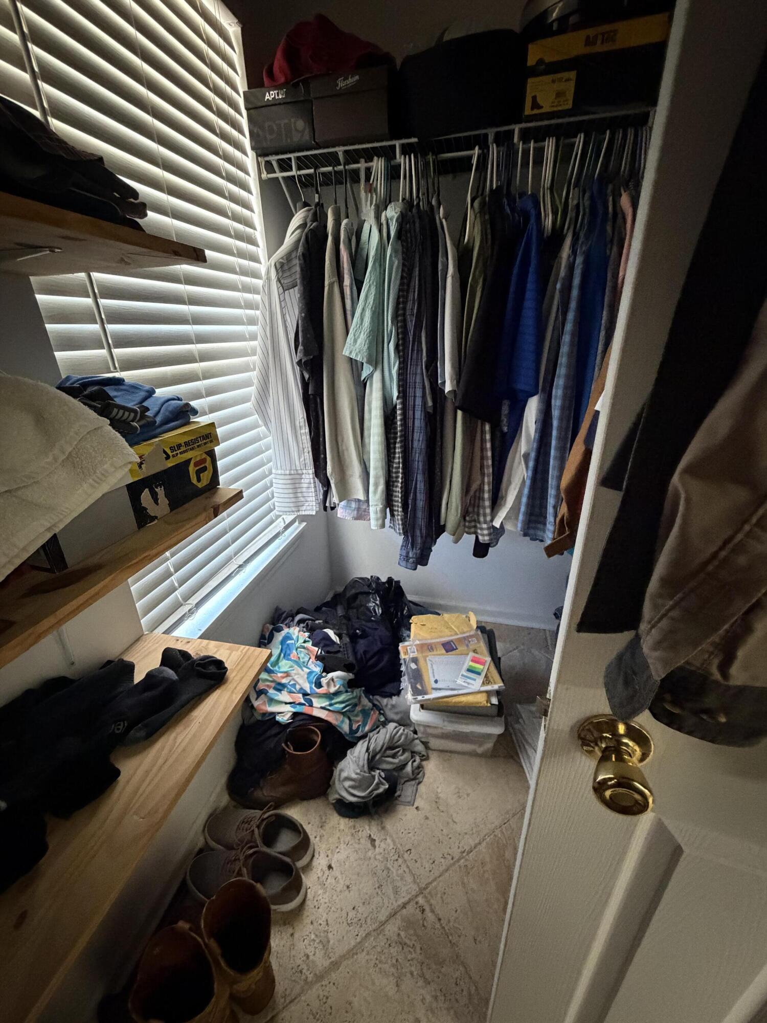 19818 Deep Springs Road Fountain, FL 32438 - Photo 11 of 21 a view of walk in closet with clothes and shoes