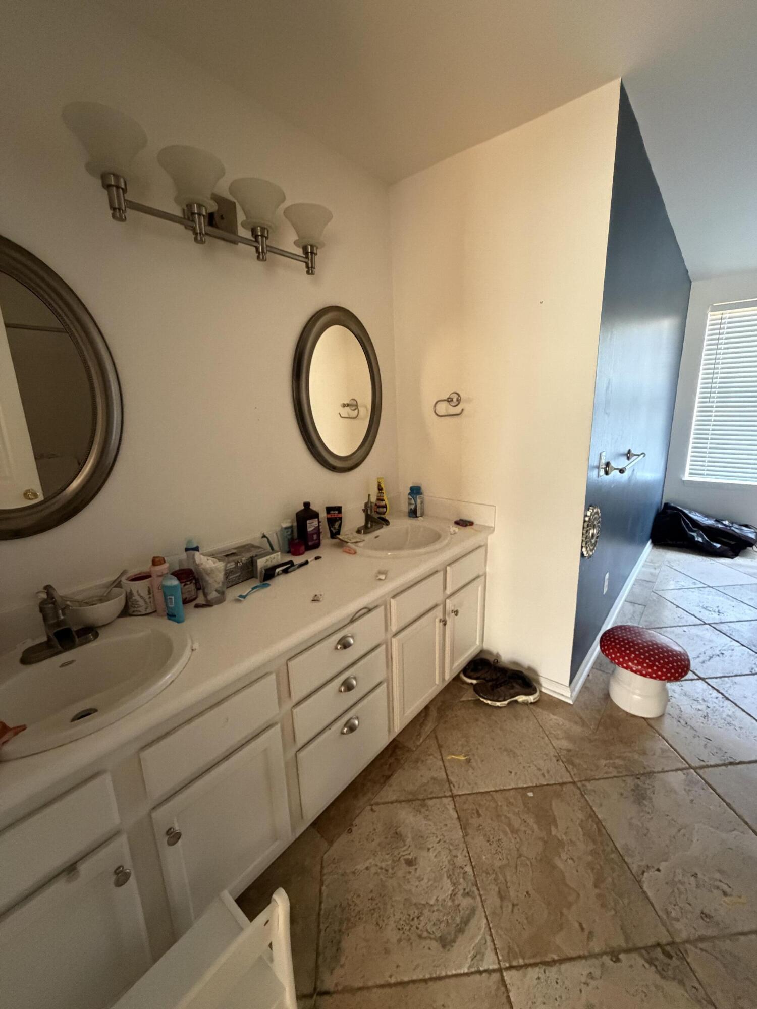 19818 Deep Springs Road Fountain, FL 32438 - Photo 15 of 21 a bathroom with a double vanity sink and a mirror