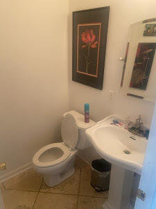 19818 Deep Springs Road Fountain, FL 32438 - Photo 17 of 21 a bathroom with a toilet a sink and mirror