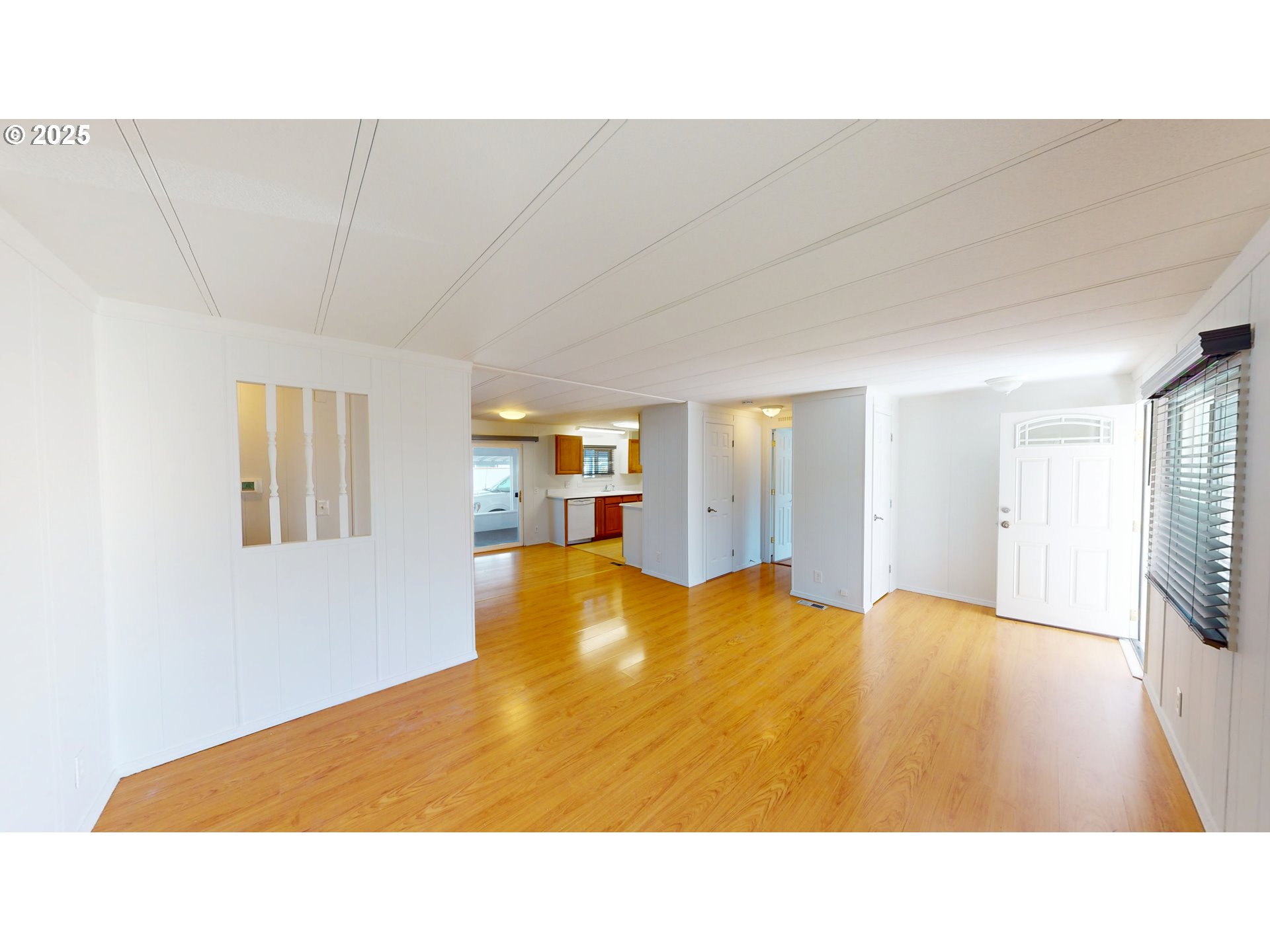 15889 Sunset Strip, Unit 102 Brookings, OR 97415 - Photo 11 of 27 a room with a bed furniture and a flat screen tv