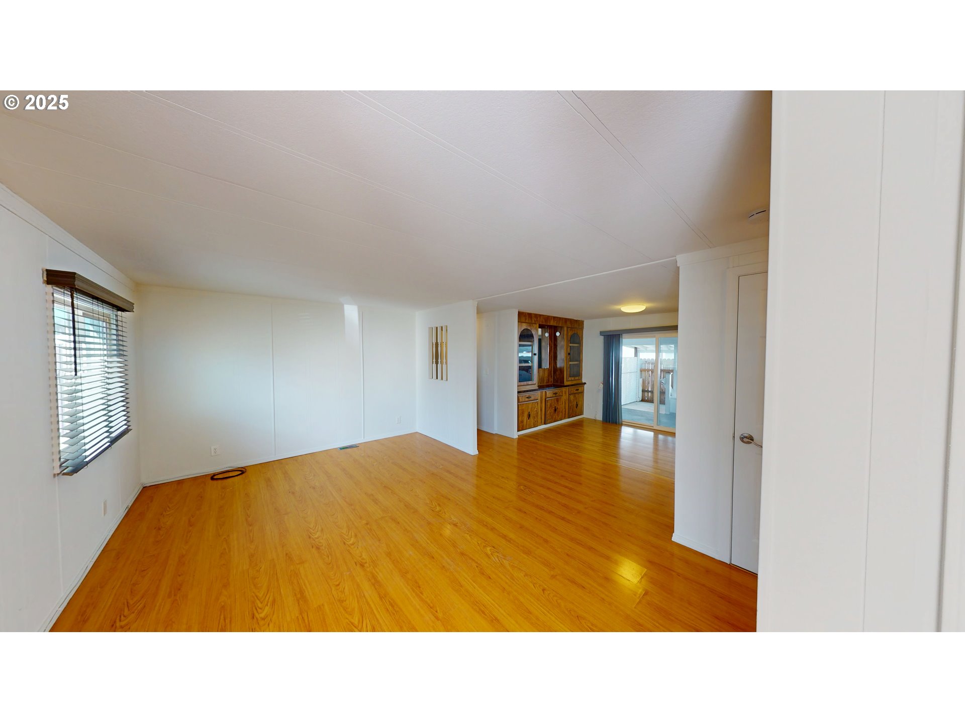 15889 Sunset Strip, Unit 102 Brookings, OR 97415 - Photo 12 of 27 a room with a bed and table