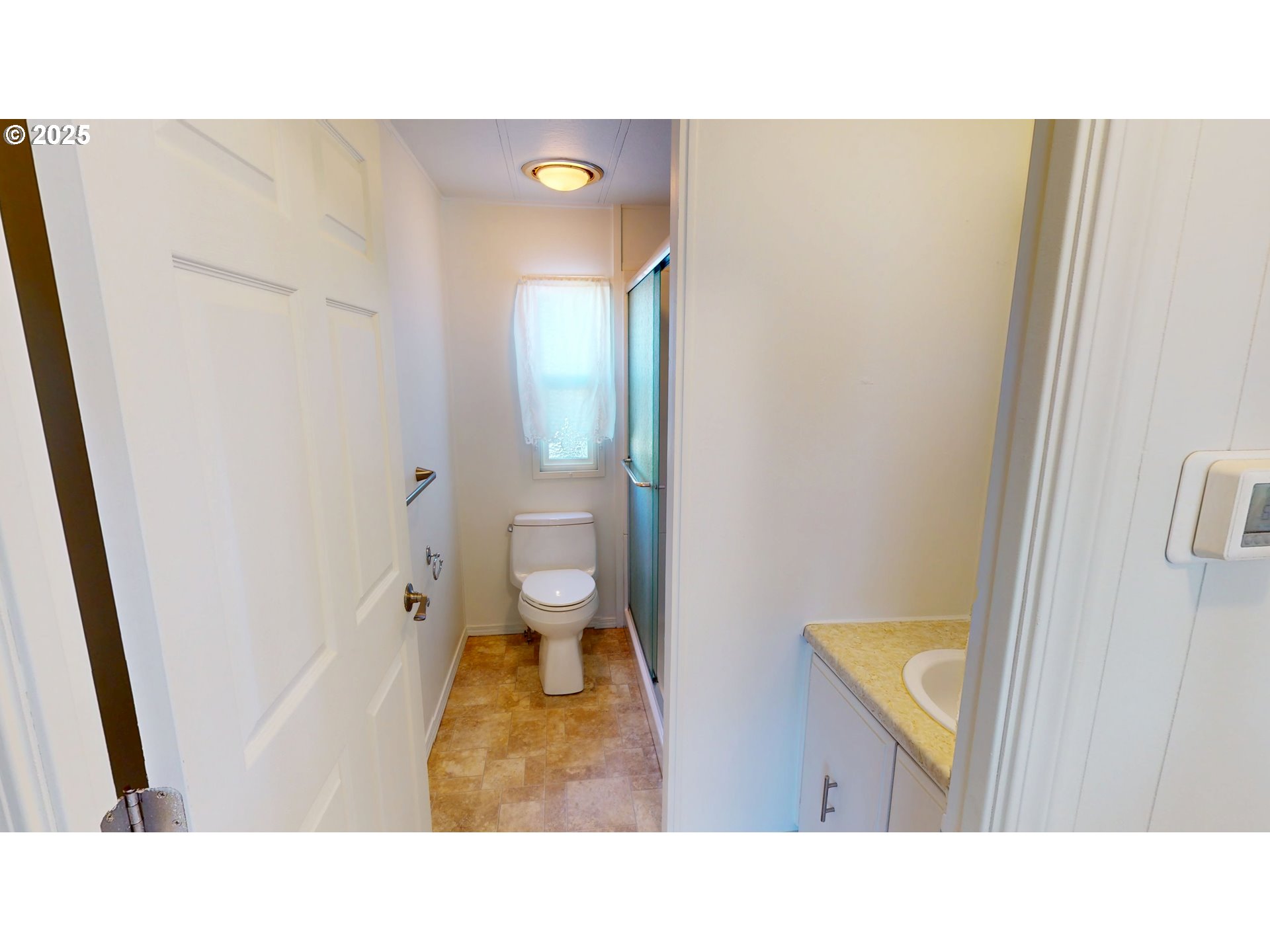 15889 Sunset Strip, Unit 102 Brookings, OR 97415 - Photo 19 of 27 a bathroom with a sink and a mirror