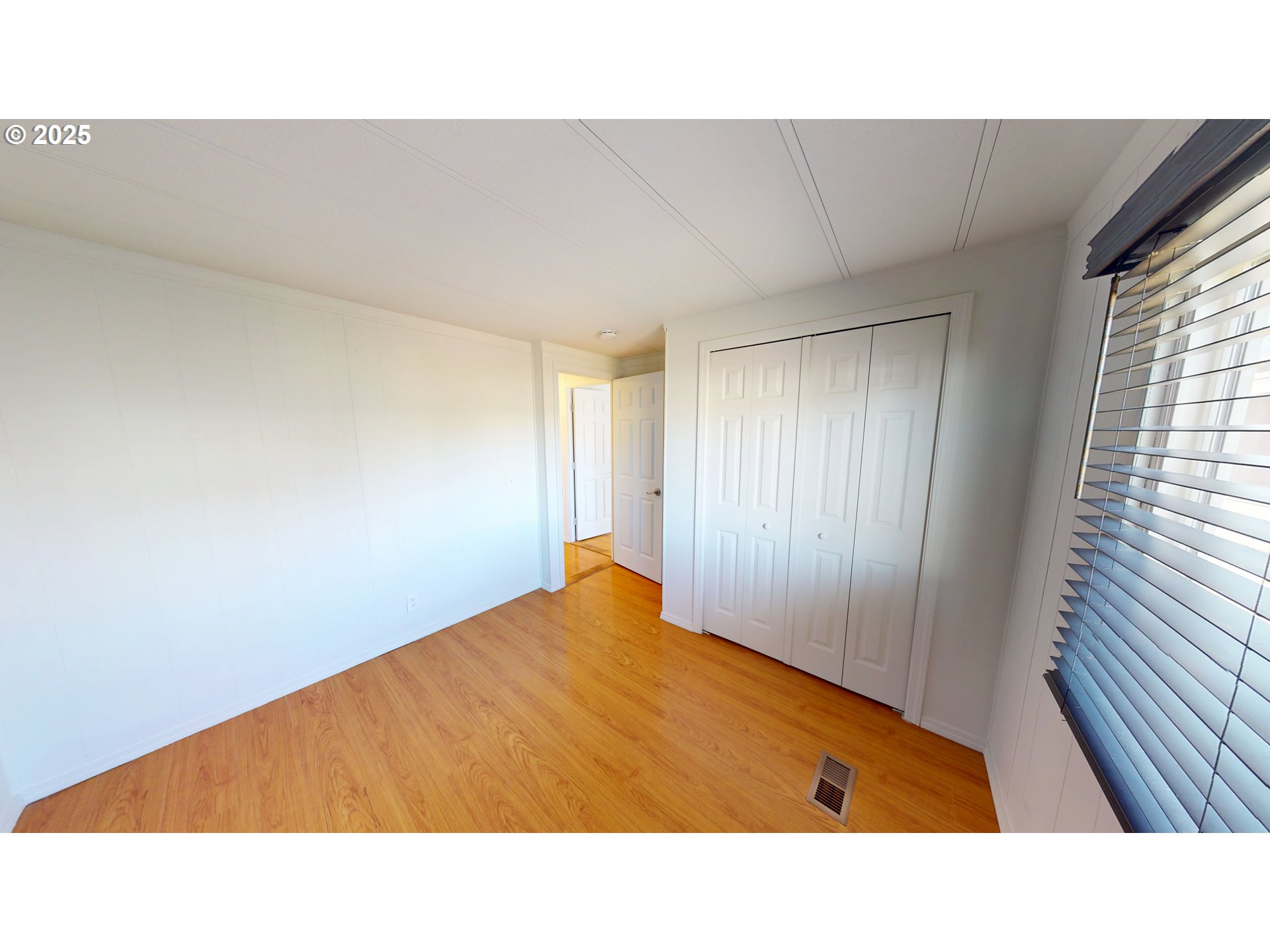15889 Sunset Strip, Unit 102 Brookings, OR 97415 - Photo 22 of 27 a room with a bed