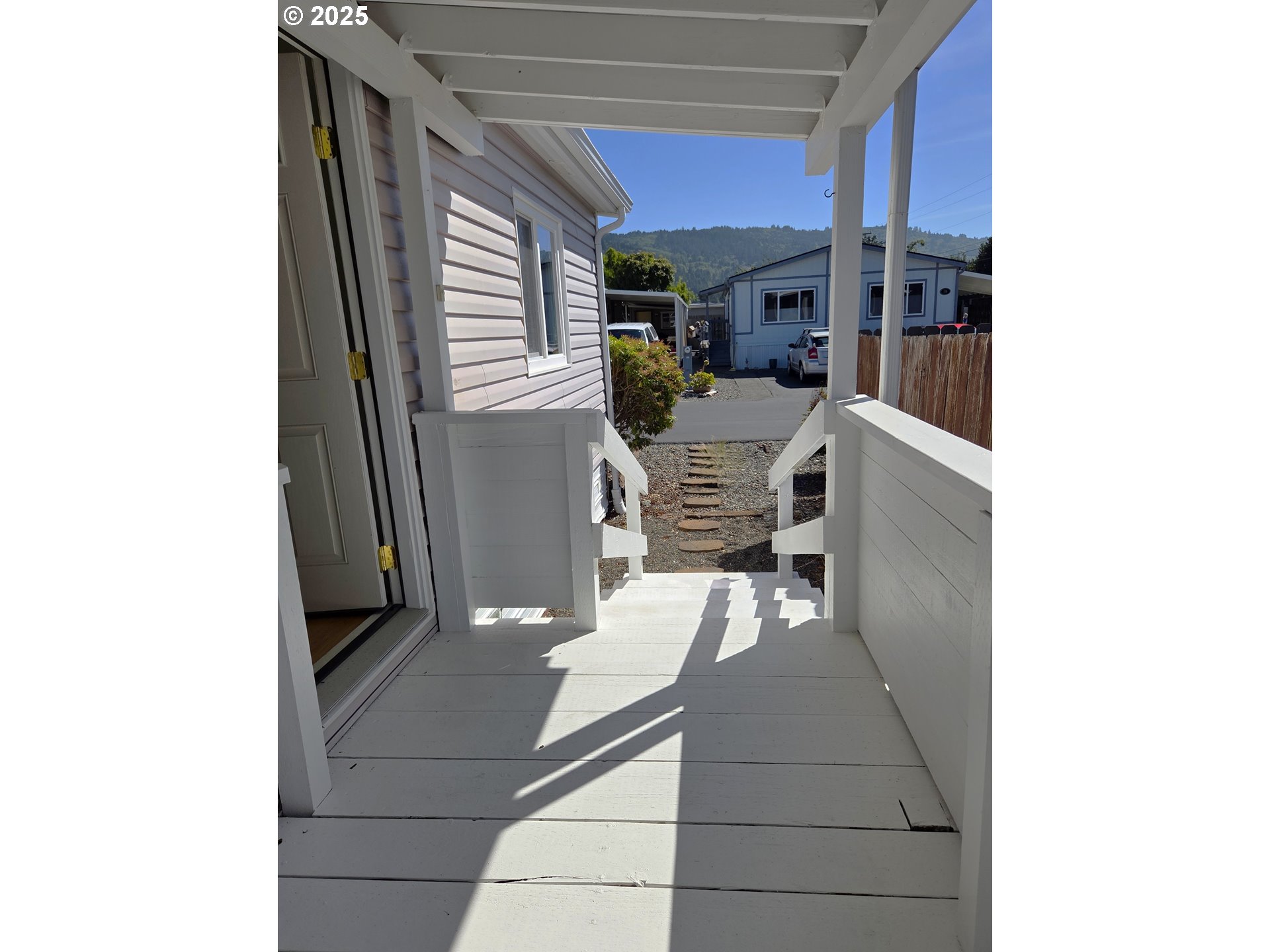 15889 Sunset Strip, Unit 102 Brookings, OR 97415 - Photo 23 of 27 a living room with furniture and a fireplace
