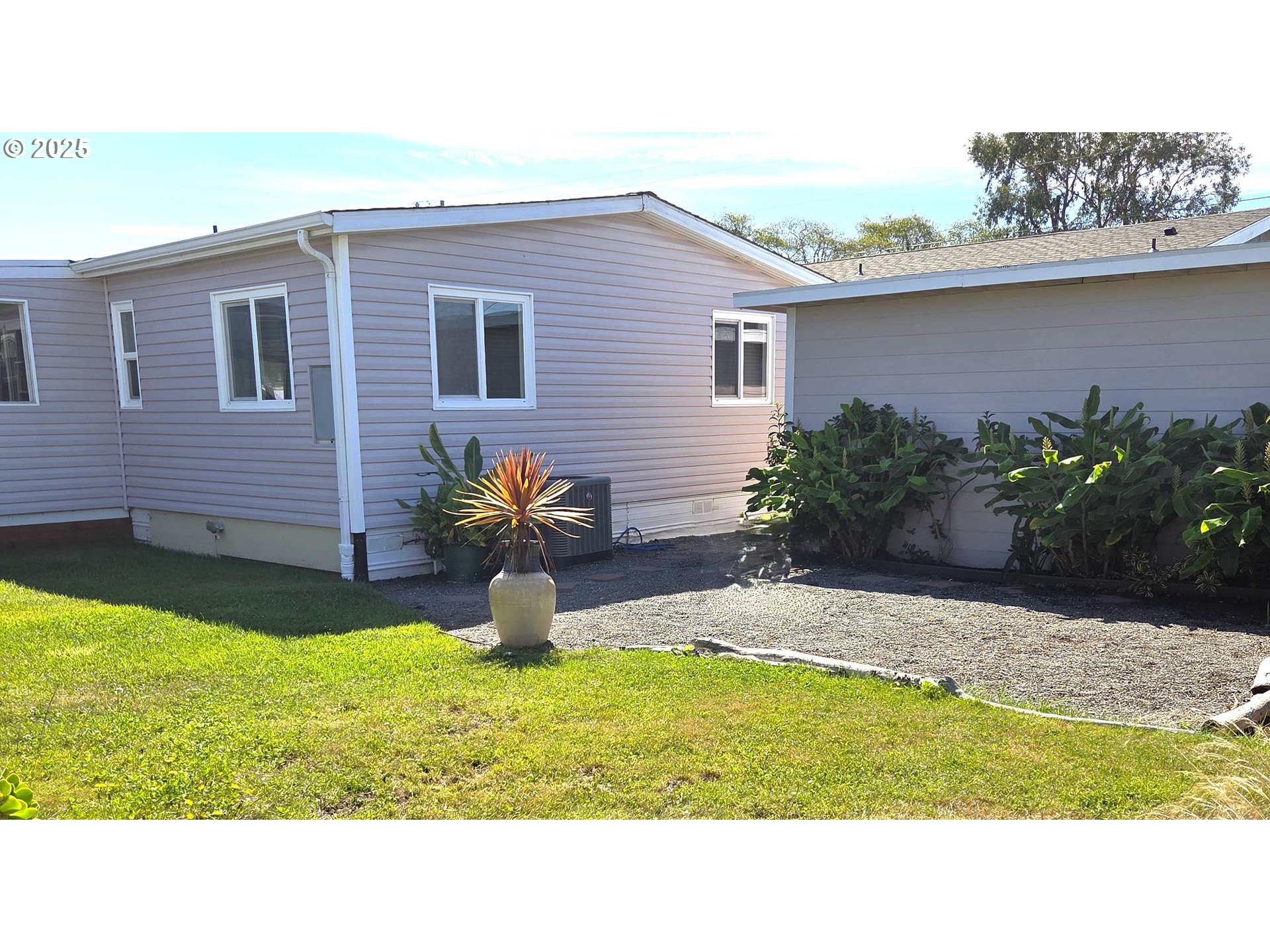 15889 Sunset Strip, Unit 102 Brookings, OR 97415 - Photo 24 of 27 a house view with a garden space